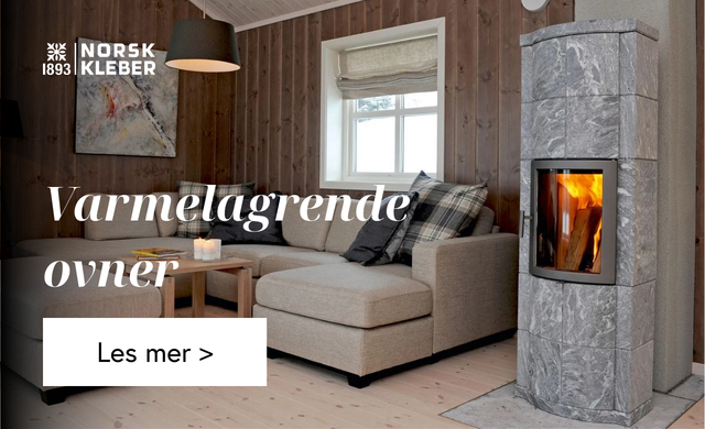 Bilde av en klebersteinsovn i et hyttemiljø 